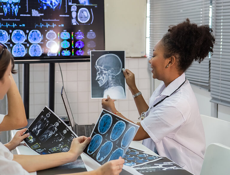 women looking at x-rays